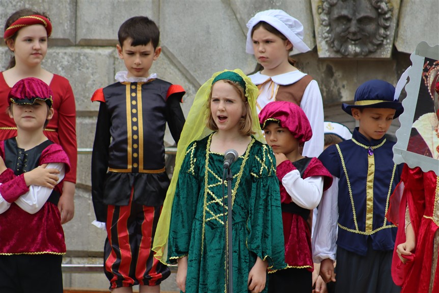 Year 3 and 4 perform tudor performance on stage